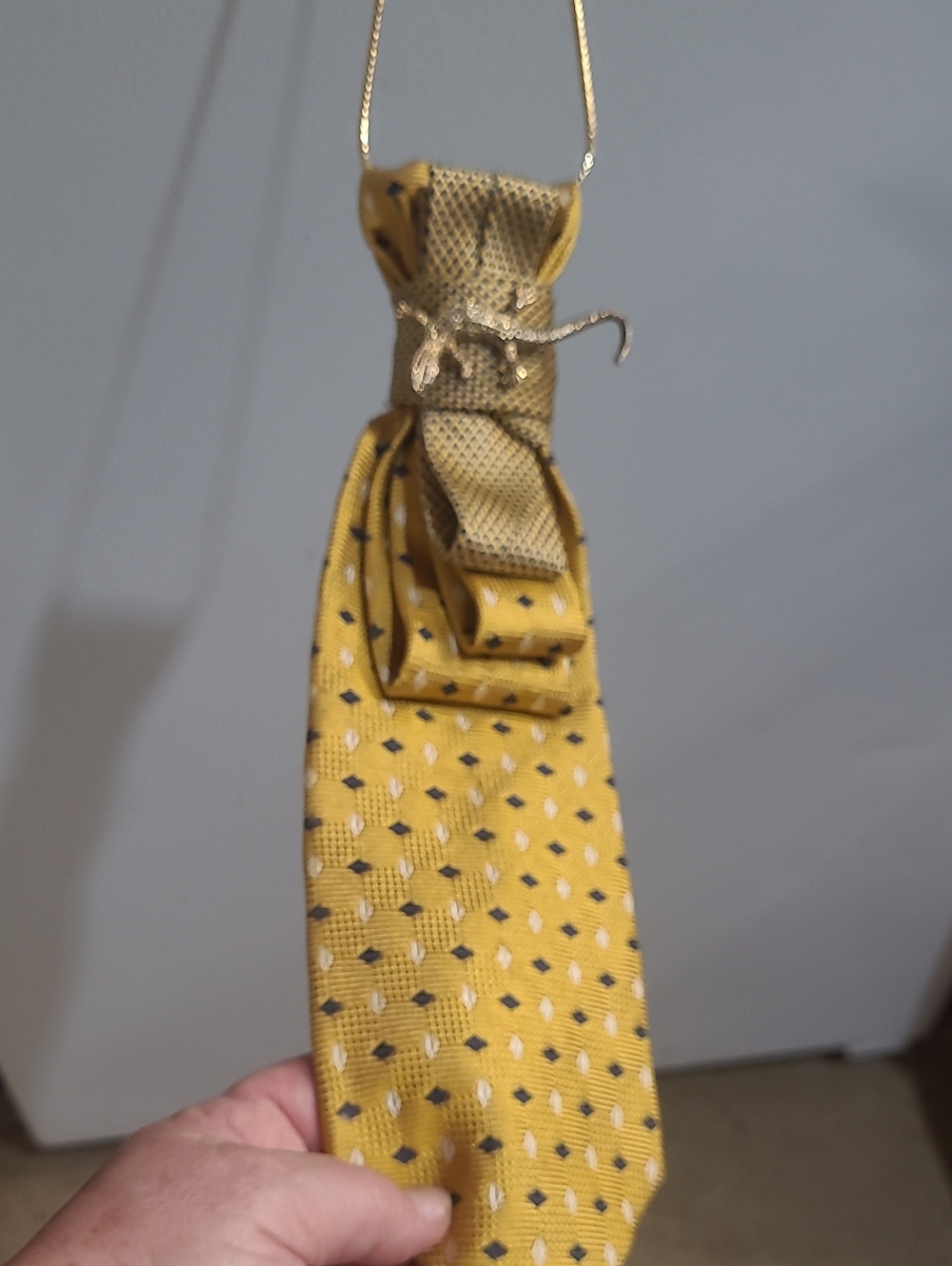 Gold Tone Necklace & Yellow  Patterned Tie with Textured Knot/Brooch Detail